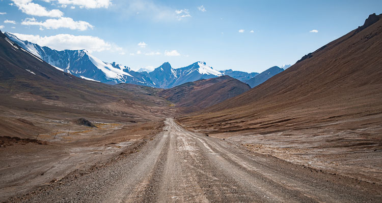 Mountain landscape in the Pamirs in Central Asia, Descent of the Ak-Baïtal pass, Adventure in Tajikistan by bike, Travel in Central Asia